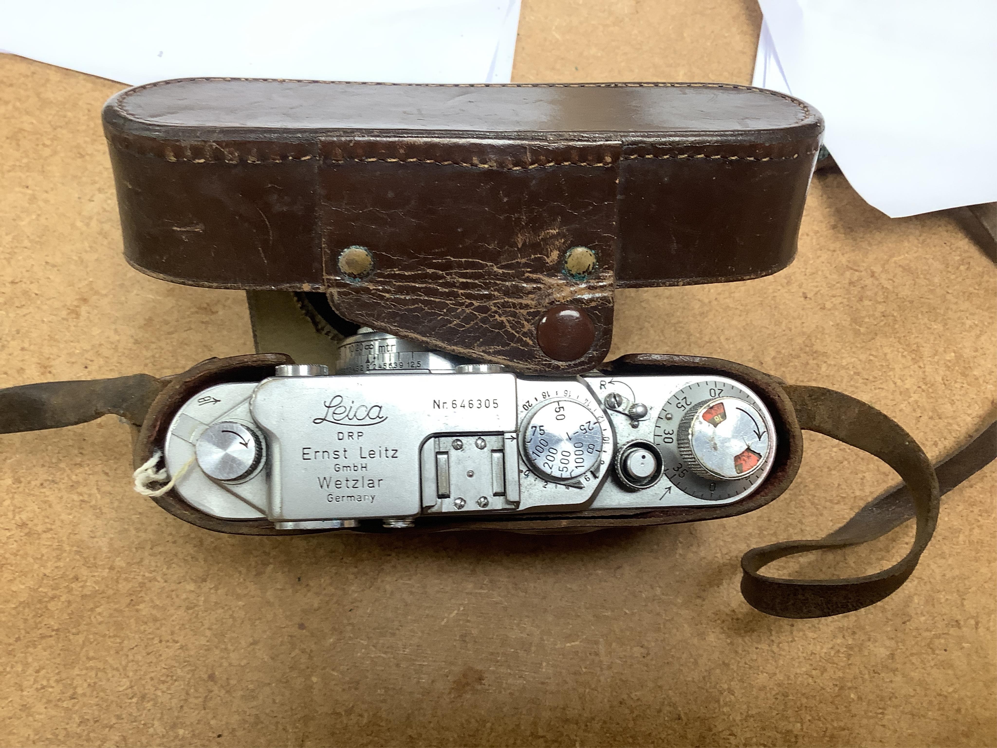 A Leica IIIf camera, Nr.646305, with summar f=5cm 1:2 lens, with leather case with strap